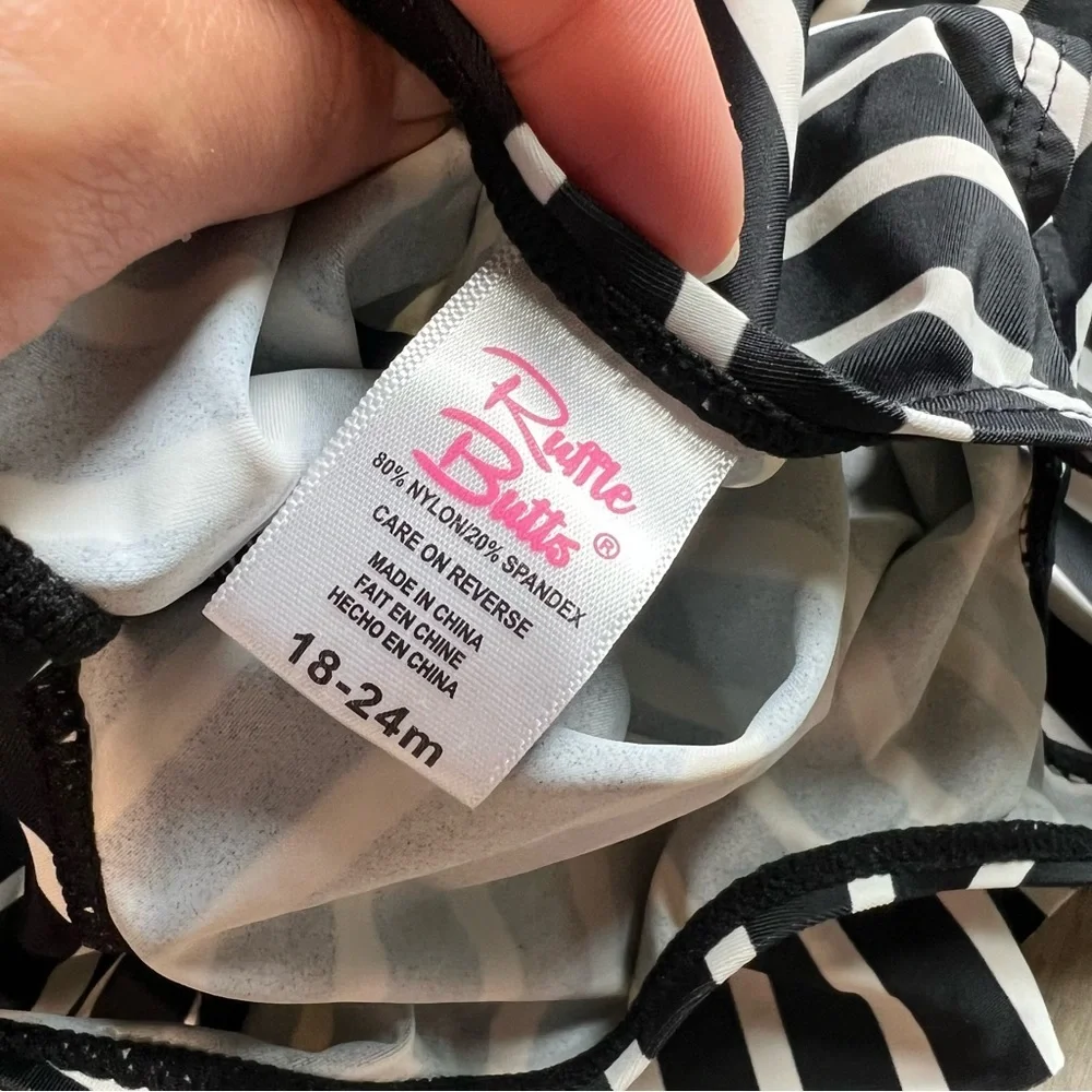 RuffleButts Black White Striped Skirted One Piece Swimsuit